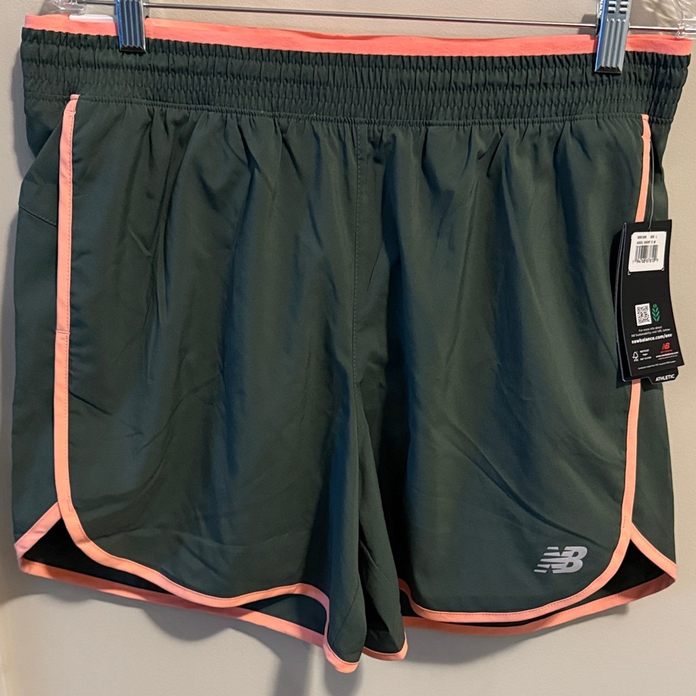 New Balance Women's Accel Athletic Shorts in Dark Green with Pink Accents